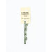 A skein of jade green embroidery floss, twisted and bundled, with a cream and black label featuring the brand name and color information.