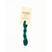 A skein of dark teal embroidery floss, twisted and bundled, with a cream and black label featuring the brand name and color information.