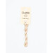 A skein of very light pink embroidery floss, twisted and bundled, with a cream and black label featuring the brand name and color information.