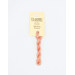 A skein of peach pink embroidery floss, twisted and bundled, with a cream and black label featuring the brand name and color information.