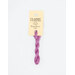 A skein of orchid pink embroidery floss, twisted and bundled, with a cream and black label featuring the brand name and color information.