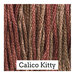 A variegated swatch of Classic Colorworks floss in the colors muted red and brown.