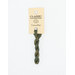 A skein of muted sage embroidery floss, twisted and bundled, with a cream and black label featuring the brand name and color information.