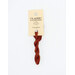 A skein of brick red embroidery floss, twisted and bundled, with a cream and black label featuring the brand name and color information.