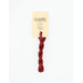 A skein of cherry red embroidery floss, twisted and bundled, with a cream and black label featuring the brand name and color information.