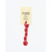 A skein of rose red embroidery floss, twisted and bundled, with a cream and black label featuring the brand name and color information.