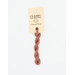 A skein of dusty rose embroidery floss, twisted and bundled, with a cream and black label featuring the brand name and color information.