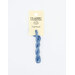 A skein of ocean blue embroidery floss, twisted and bundled, with a cream and black label featuring the brand name and color information.
