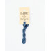 A skein of medium blue embroidery floss, twisted and bundled, with a cream and black label featuring the brand name and color information.