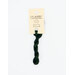 A skein of emerald green embroidery floss, twisted and bundled, with a cream and black label featuring the brand name and color information.