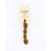 A skein of suede brown embroidery floss, twisted and bundled, with a cream and black label featuring the brand name and color information.