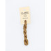 A skein of light brown embroidery floss, twisted and bundled, with a cream and black label featuring the brand name and color information.