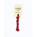 A skein of red embroidery floss, twisted and bundled, with a cream and black label featuring the brand name and color information.