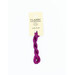 A skein of magenta purple embroidery floss, twisted and bundled, with a cream and black label featuring the brand name and color information.