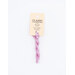 A skein of lilac pink embroidery floss, twisted and bundled, with a cream and black label featuring the brand name and color information.