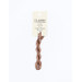 A skein of cocoa brown embroidery floss, twisted and bundled, with a cream and black label featuring the brand name and color information.