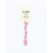 A skein of light pink embroidery floss, twisted and bundled, with a cream and black label featuring the brand name and color information.