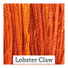 A variegated swatch of Classic Colorworks floss in the color orange. 