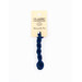 A skein of navy blue embroidery floss, twisted and bundled, with a cream and black label featuring the brand name and color information.