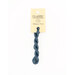 A skein of steel blue embroidery floss, twisted and bundled, with a cream and black label featuring the brand name and color information.