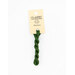 A skein of dark green embroidery floss, twisted and bundled, with a cream and black label featuring the brand name and color information.