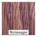 A variegated swatch of Classic Colorworks floss in the colors purple and pink. 