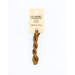 A skein of suede brown embroidery floss, twisted and bundled, with a cream and black label featuring the brand name and color information.