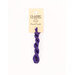 A skein of purple embroidery floss, twisted and bundled, with a cream and black label featuring the brand name and color information.