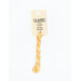 A skein of variegated peach and yellow embroidery floss, twisted and bundled, with a cream and black label featuring the brand name and color information.
