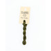 A skein of green embroidery floss, twisted and bundled, with a cream and black label featuring the brand name and color information.