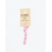 A skein of pastel pink embroidery floss, twisted and bundled, with a cream and black label featuring the brand name and color information.