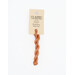 A skein of light pumpkin embroidery floss, twisted and bundled, with a cream and black label featuring the brand name and color information.