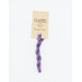 A skein of lavender embroidery floss, twisted and bundled, with a cream and black label featuring the brand name and color information.