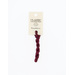 A skein of burgundy embroidery floss, twisted and bundled, with a cream and black label featuring the brand name and color information.