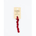 A skein of cherry red embroidery floss, twisted and bundled, with a cream and black label featuring the brand name and color information.