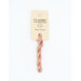 A skein of coral pink embroidery floss, twisted and bundled, with a cream and black label featuring the brand name and color information.