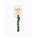 A skein of dark green embroidery floss, twisted and bundled, with a cream and black label featuring the brand name and color information.