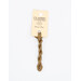 A skein of brown embroidery floss, twisted and bundled, with a cream and black label featuring the brand name and color information.