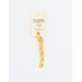 A skein of bright yellow embroidery floss, twisted and bundled, with a cream and black label featuring the brand name and color information.