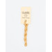 A skein of pale orange embroidery floss, twisted and bundled, with a cream and black label featuring the brand name and color information.