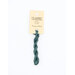 A skein of dark teal embroidery floss, twisted and bundled, with a cream and black label featuring the brand name and color information.