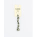 A skein of sage green embroidery floss, twisted and bundled, with a cream and black label featuring the brand name and color information.