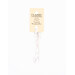 A skein of white embroidery floss, twisted and bundled, with a cream and black label featuring the brand name and color information.