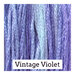 A variegated swatch of Classic Colorworks floss in the colors purple and light blue. 