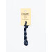 A skein of indigo blue embroidery floss, twisted and bundled, with a cream and black label featuring the brand name and color information.