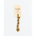 A skein of gold embroidery floss, twisted and bundled, with a cream and black label featuring the brand name and color information.