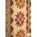 A stylized close up on the quilt, taken at a slight angle and demonstrating the patchwork details of the quilt, including fabric, color, and top quilting details.