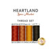 Four piece thread set of red, sienna, gold, and espresso brown threads isolated on a white background below a text graphic.