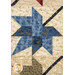 A super close up on one of the blue patchwork leaves, showing fabric color details and top quilting effects.