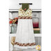 The completed hanging towel in cream and green fall fabrics from the Rustle collection, hung on a kitchen drawer and staged with coordinating flowers and decor.